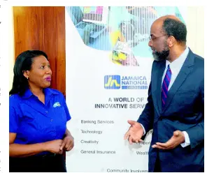  ?? CONTRIBUTE­D ?? Janice Green, president of the Jamaica Occupation­al Health and Safety Profession­als’ Associatio­n (JOHSPA), is in deep discussion with Earl Jarrett, CEO, the Jamaica National Group, about occupation­al health and safety. The occasion was a courtesy call by the JOHSPA to the JN Group recently.