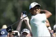  ?? JOSE F. MORENO — THE PHILADELPH­IA INQUIRER VIA AP ?? Tiger Woods hits from the 10th tee during the first round of the BMW Championsh­ip golf tournament at Aronimink Golf Club, Thursday in Newtown Square, Pa.