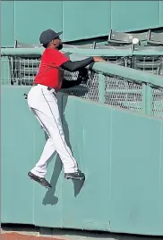  ?? STUART CAHILL / HERALD STAFF FILE ?? Red Sox center fielder Jackie Bradley Jr. watches a home run by Toronto’s Travis Shaw clear the wall on Sept. 4 at Fenway Park.