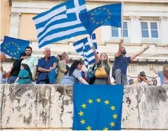  ??  ?? Protesters occupy the exterior of the parliament building in Athens in June 2015