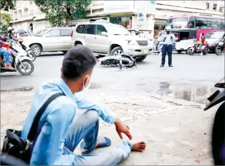  ?? HENG CHIVOAN ?? A man is injured in a road accident in Tuol Svay Prey commune of Phnom Penh’s Boeung Keng Kang district on June 22.