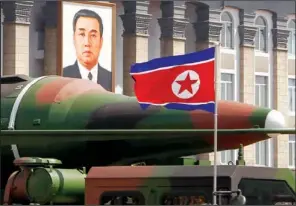  ??  ?? MISSILES: In this photo taken April 15, what appears to be a new missile is carried during a mass military parade at the Kim Il Sung Square in Pyongyang, North Korea, to celebrate the 100th anniversar­y of the country’s founding father Kim Il Sung. The...