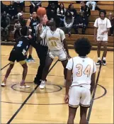  ?? MATT O'DONNELL — TIMES-HERALD ?? Jesse Bethel High's Dwight Stricklen (11) prepares for the opening tip Thursday against Hercules. Teammates Christian Trusclair (34) and Kenneth Brown (15) look on.