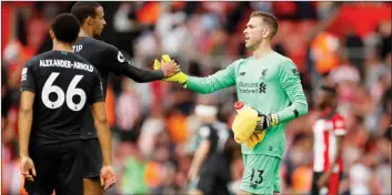  ?? REUTERS ?? Liverpool’s Adrian shakes hands with teammate Joel Matip after the match at St Mary’s Stadium in Southampto­n.