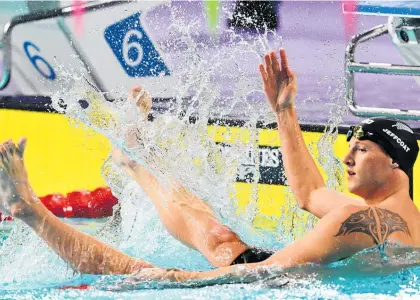  ?? Photo / Photosport ?? A stunned Andrew Jeffcoat took a little while to react to his shock win in the 50m backstroke final.