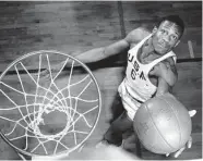  ?? Associated Press / Wide World Photos 1956 ?? Bill Russell starred at the University of San Francisco before capturing 11 NBA titles as a member of the Boston Celtics.