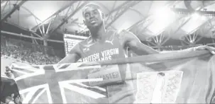  ??  ?? BVI’s Kyron McMaster celebrates winning Commonweal­th Gold in the 400m hurdles.