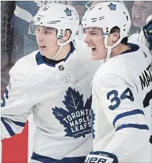  ?? GRAHAM HUGHES THE CANADIAN PRESS ?? Auston Matthews, right, is celebratin­g a new contract with the Leafs but Mitch Marner, left, is going to have to wait.