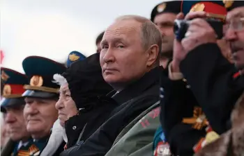  ?? (Mikhail Metzel/Sputnik/Pool/via Reuters) ?? RUSSIAN PRESIDENT Vladimir Putin watches a military parade in Moscow’s Red Square on Victory Day, May 9, marking the anniversar­y of the victory over Nazi Germany in World War II.