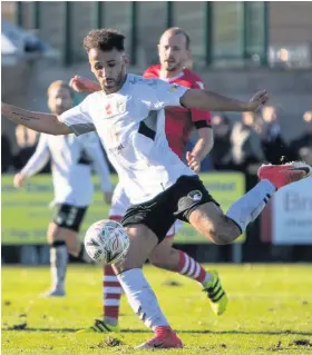  ??  ?? Weston’s Gethyn Hill lines up a shot against Wrexham yesterday