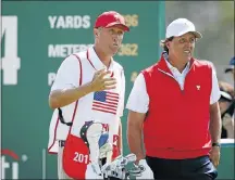  ?? Picture: REUTERS ?? METTLESOME: Phil Mickelson talks with his caddie Jim Mackay in the opening foursomes in Incheon yesterday.