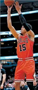  ?? CHRIS SWEDA/CHICAGO TRIBUNE ?? Bulls forward Chandler Hutchison shoots a 3-pointer against the Hawks at the United Center on Jan. 23. Hutchison fractured the sesamoid bone in his right foot that month.