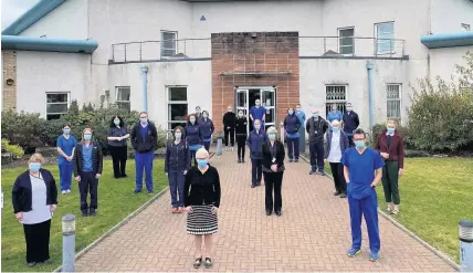  ??  ?? Next chapter Retiring practice manager Jill Hall is pictured in the centre of the front row with Dr Stuart Evans, front right, and colleagues at the Blue Practice