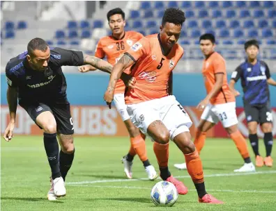 ?? AP ?? Gamba Osaka’s Leandro Marcos Pereira, left, and Chiangrai United’s Brinner in action during the AFC Champions League Group H match between Gamba Osaka and Chiangrai United on Sunday.
