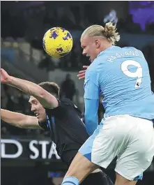  ?? REUTERS ?? Manchester City's Erling Haaland leaps above Burnley’s Dara O'Shea during an EPL match at Etihad Stadium, Wednesday.