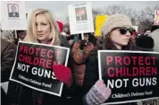  ?? YURI GRIPASYURI GRIPAS/AFP/GETTY IMAGES ?? Recent polls indicate that most National Rifle Associatio­n members actually support background checks.