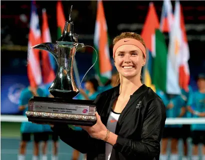  ?? Getty file ?? Svitolina poses with the trophy after defeating Woznacki in the Dubai Duty Free Tennis Championsh­ip final last year. —