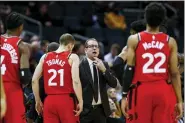  ?? NELL REDMOND — THE ASSOCIATED PRESS FILE ?? In this Jan. 8, 2020, file photo, Toronto Raptors coach Nick Nurse, center, gathers his team during a timeout in the first half of an NBA basketball game against the Charlotte Hornets in Charlotte, N.C. The Raptors have an NBA championsh­ip to defend, a very long stay at the Disney complex awaiting them and plenty of unanswered questions on how the restart of the season will work. As the NBA’s lone Canadian team, there’s an added complexity: The U.S. border. Nurse said Tuesday, June 9, 2020, that his team is still working through various scenarios for having workouts before heading to Disney World near Orlando, Florida along with 21other teams next month for the restart of the season.