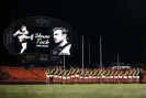  ?? Photograph: Ryan Pierse/Getty Images ?? Richmond players stand for a minutes silence in memory of former teammate Shane Tuck at a game in 2020.