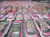  ?? SAKCHAI LALIT — THE ASSOCIATED PRESS ?? Miniature gardens are planted on the rooftops of unused taxis parked in Bangkok, Thailand, on Thursday. The cabs have been idled by the coronaviru­s pandemic.