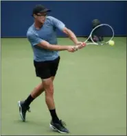  ?? ANDRES KUDACKI — ASSOCIATED PRESS ?? Peter Polansky returns a shot to Alexander Zverev during the first round of the U.S. Open on Aug. 28 in New York.