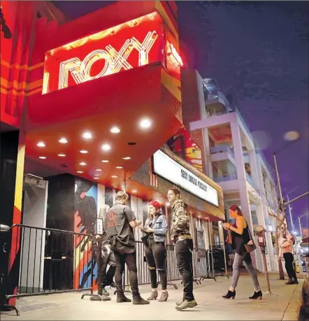  ?? Gary Coronado Los Angeles Times ?? NIGHTCLUBS including the Roxy were open Wednesday. Concertgoe­rs reacted to coronaviru­s concerns with humor and pragmatism.