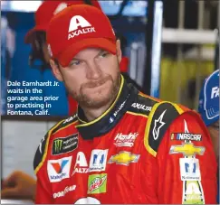  ??  ?? Dale Earnhardt Jr. waits in the garage area prior to practising in Fontana, Calif.