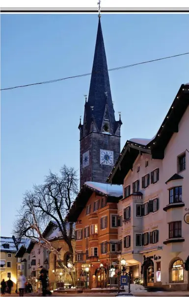  ??  ?? Snow business: St Catherine’s Church, built in 1366, in car-free Kitzbühel.
Below: a grole, filled with coffee, grappa and heaven knows what