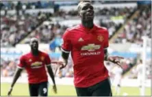  ?? THE ASSOCIATED PRESS ?? Manchester United’s Paul Pogba celebrates scoring his side’s third goal during the English Premier League soccer match between Swansea and Manchester United at the Liberty Stadium, in Swansea, Wales.