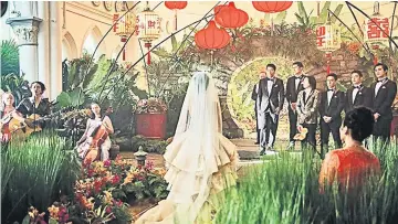  ?? — Warner Bros photo ?? Wedding scene between the lead characters portrayed by Henry Golding and Constance Wu.