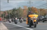  ??  ?? Hundreds of motorcycli­sts participat­e in the 20th annual Toys for Tots Benefit Ride on Sunday, beginning at Brunswick Harley-Davidson.