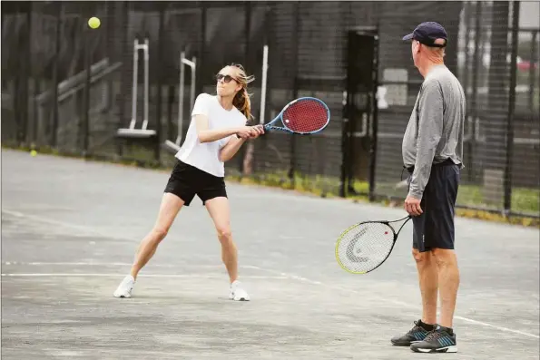  ?? Ned Gerard / Hearst Connecticu­t Media ?? Tennis players at Longshore Club Park in Westport on Wednesday.