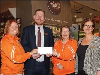  ??  ?? Nicky Byrne, manager, Pettitt’s Supervalu St. Aidan’s, presents a cheque for €2,125 to Relay For Life organisers Gay Murphy (left) and Siobhan Murphy, with Fiona Murphy, Pettitt’s Supevalu, on right.