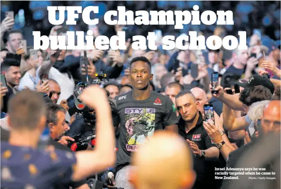  ?? Photo / Getty Images ?? Israel Adesanya says he was racially targeted when he came to New Zealand.