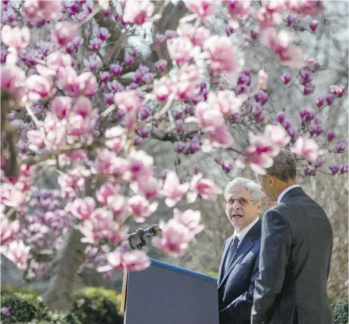  ?? ANDREW HARNIK / THE ASSOCIATED PRESS ?? Federal appeals court judge Merrick Garland is accompanie­d by U. S. President Barack Obama on Wednesday at theWhite House. Garland is Obama’s choice to replace the late Antonin Scalia on the Supreme Court bench.