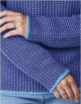  ??  ?? The contrast edging is a striking design feature that makes this sweater stand out.
