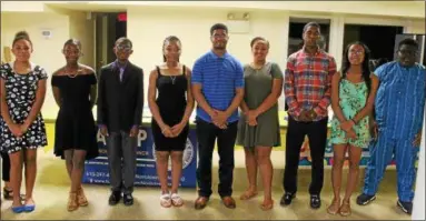  ?? OSCAR GAMBLE — DIGITAL FIRST MEDIA ?? From left, Kathryn Griffin, Ayana Lyons Perry, Ted Mensah, Sabria Tamir Alston, Quinton Turner, Hannah Griffin, Joshua Butler, Jonae Cook, and Kingsley Udesbunam, pose for photos after being awarded scholarshi­ps from the Greater Norristown NAACP, Tuesday, June 26.