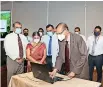  ??  ?? Minister of Education, (Prof.) G. L. Peiris, launching the newly developed online system.