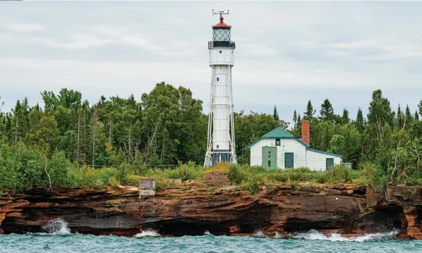  ??  ?? The current lighthouse tower on Devils Island (below) was erected in 1898. During the summer, the lighthouse is a popular stop for visitors. Lake Superior offers challengin­g and exciting sailing conditions, and Bliss handled them well (opposite right).