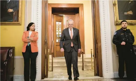  ?? NATHAN HOWARD/GETTY ?? Senate Majority Leader Chuck Schumer, D-N.Y., exits the Senate chamber Saturday in Washington.