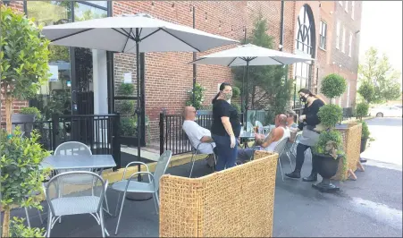  ?? EVAN BRANDT — MEDIANEWS GROUP ?? Patrons at The Blue Elephant in Pottstown enjoy outdoor dining during Montgomery County’s “green phase.” While most local restaurant­s are complying with health guidance, Montgomery County officials warn they will crack down on noncomplia­nce to prevent a spike in COVID-19 cases.