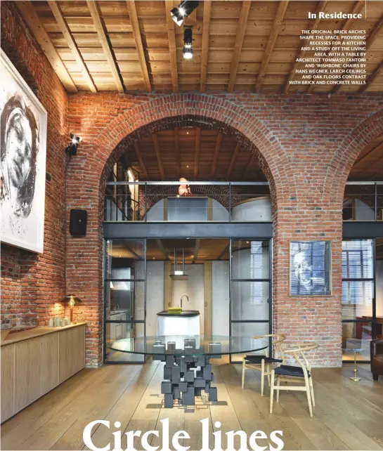  ??  ?? The original brick arches shape The space, providing recesses for a kitchen and a STUDY off The living area, With a Table by architect Tommaso fantoni and ‘Wishbone’ chairs by hans Wegner. larch ceilings and oak floors contrast With brick and concrete Walls