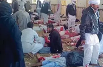  ??  ?? Horror: Victims of yesterday’s gun and bomb attack laid out in the mosque