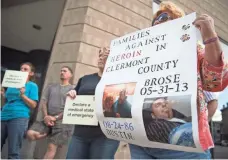  ?? JOHN MINCHILLO, AP ?? Carol DeMoss joins heroin awareness and advocacy groups that protested on the steps of the Hamilton County Justice Center after a wave of overdoses hit Cincinnati in 2016.