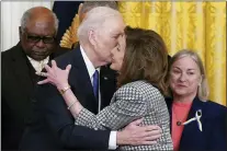  ?? CAROLYN KASTER - THE ASSOCIATED PRESS ?? President Joe Biden kisses House Speaker Nancy Pelosi of Calif., during an Affordable Care Act event in the East Room of the White House in Washington, Tuesday.