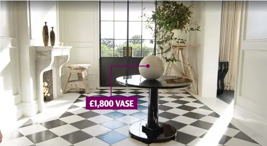  ?? ?? £1,800 VASE
Black and white: The entrance hallway has Chateau Domingue monochrome tiles and a Roman And Williams Guild spherical vase