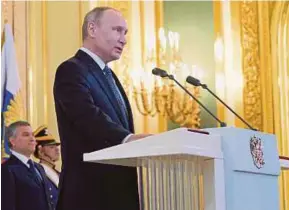  ?? EPA PIC ?? Russian President Vladimir Putin being sworn in during his inaugurati­on in the Kremlin, in Moscow, yesterday.