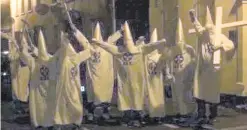  ??  ?? People dressed as Ku Klux Klan members outside the Islamic centre in Ards