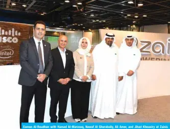  ??  ?? Eaman Al-Roudhan with Hamad Al-Marzouq, Nawaf Al Gharabally, Ali Amer, and Jihad Khoueiry at Zainís booth in GITEX.