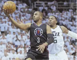  ?? AP PHOTO ?? NEW BEGINNING: Guard Chris Paul (left) was traded from the Los Angeles Clippers to the Houston Rockets yesterday.